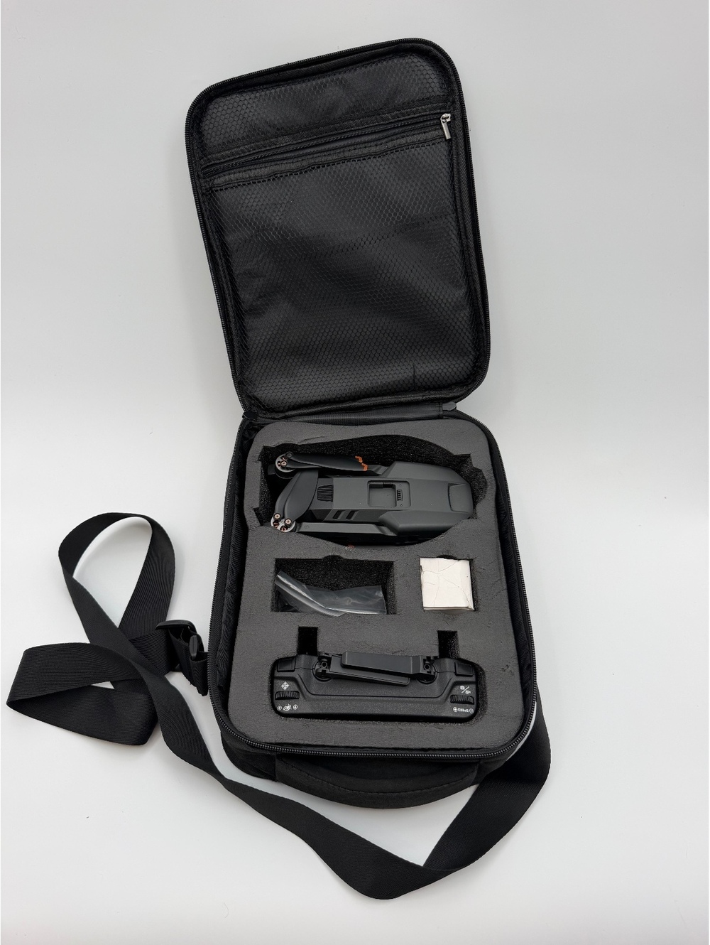 Foldable drone with remote controller carrying case and accessories